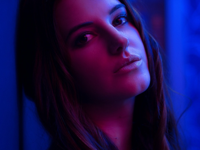 Portrait of a woman with pink and blue lighting