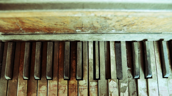Close-up of an old, abandoned piano keyboard