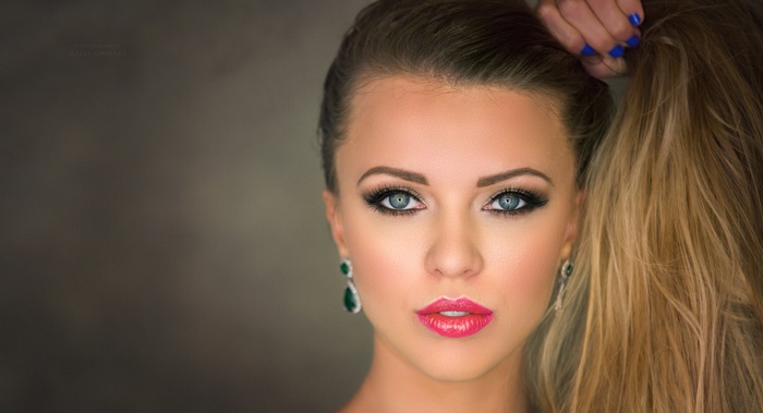 Woman with blonde hair and blue eyes