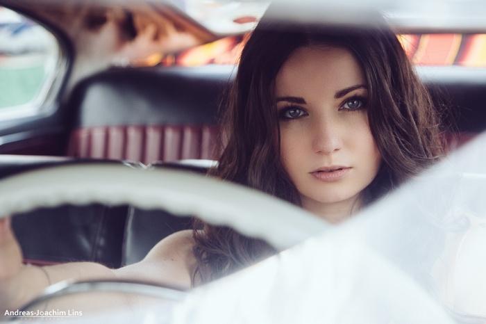Woman in a vintage car