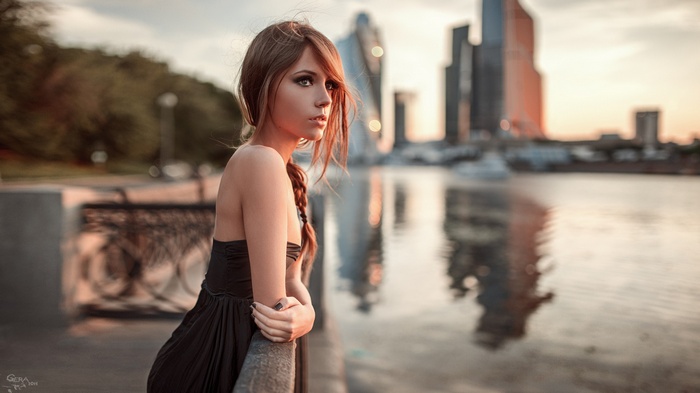 Ksenia Kokoreva by the river in the city