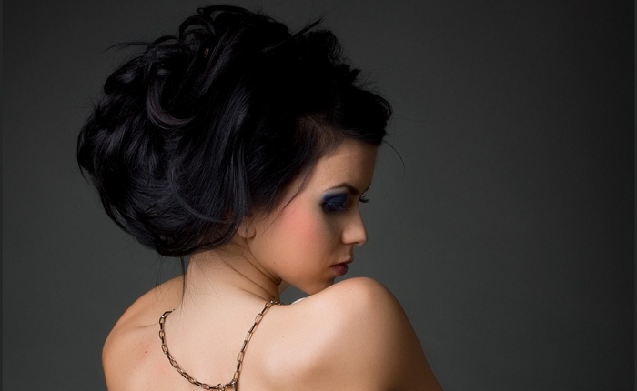 Elena Alexandra Apostoleanu with dark hair and chains