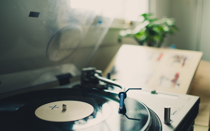 Close-up of a Technics turntable playing a vinyl record