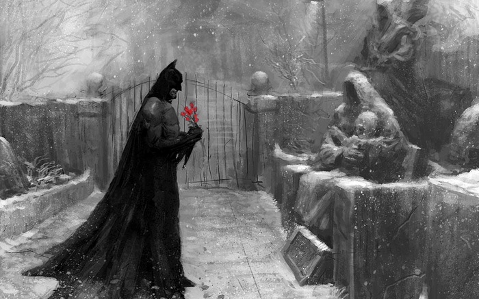 Batman holding flowers in a snowy graveyard