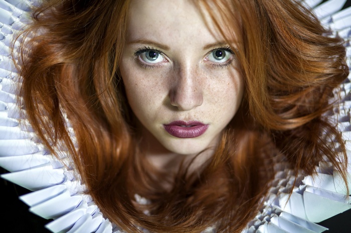 Redhead woman with freckles and white collar