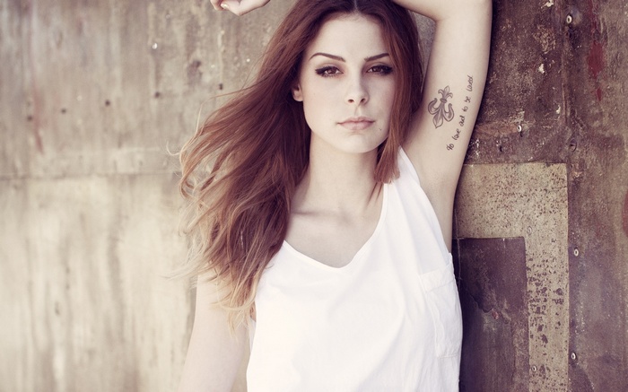 Lena Meyer-Landrut with auburn hair and a white tank top