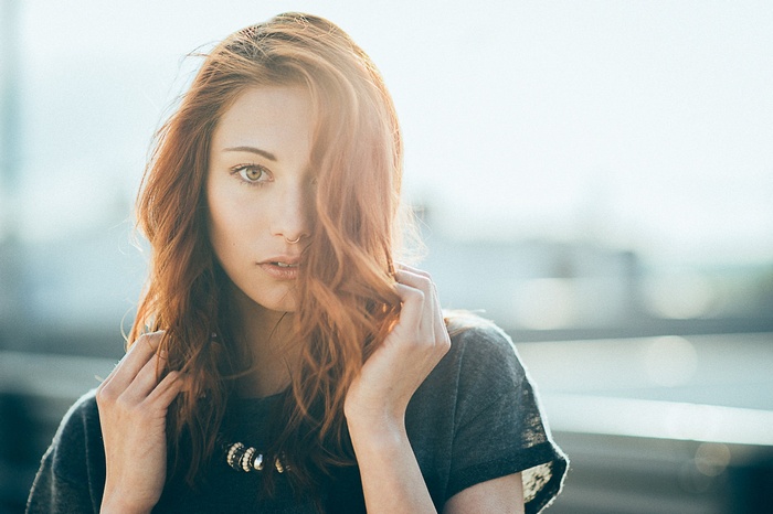 Portrait of a redhead woman with a nose ring