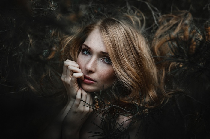 Portrait of a blonde woman with freckles