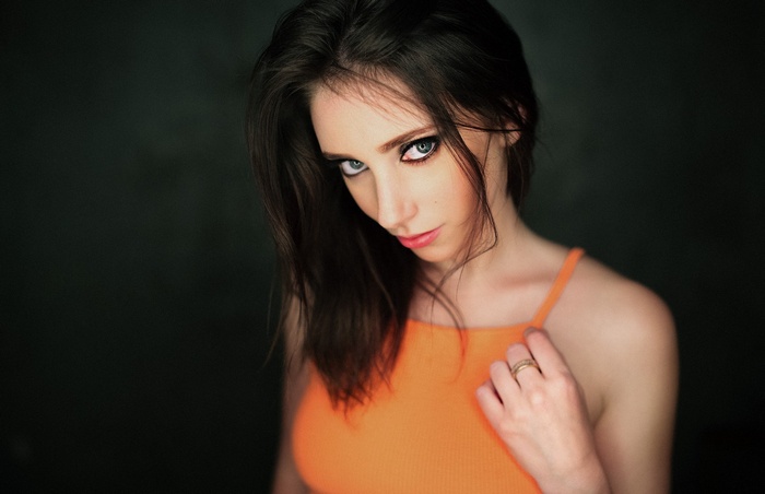 Portrait of a woman with dark hair and blue eyes