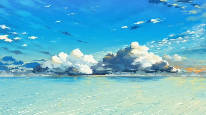 Clouds over the ocean under a blue sky