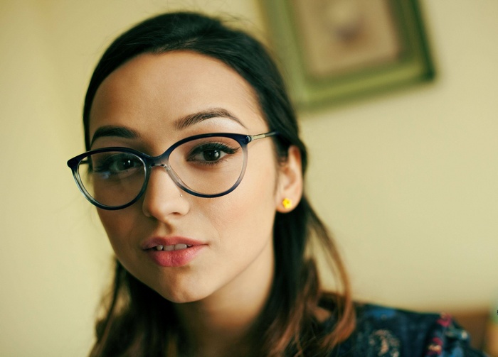 Woman with glasses and dark hair