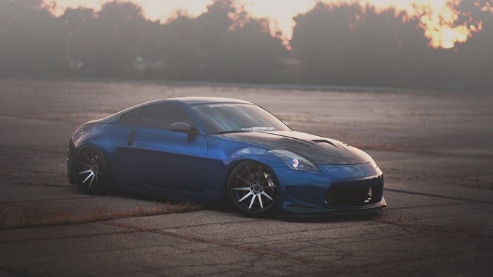 Blue Nissan 350Z with custom modifications in mist