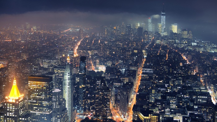 New York City skyline at night with mist