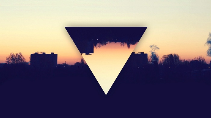 Dark city skyline with inverted triangle overlay