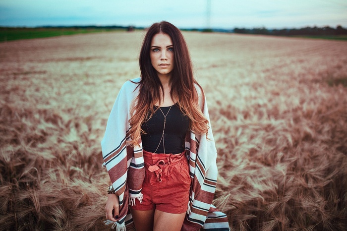 Woman with blue eyes in a field