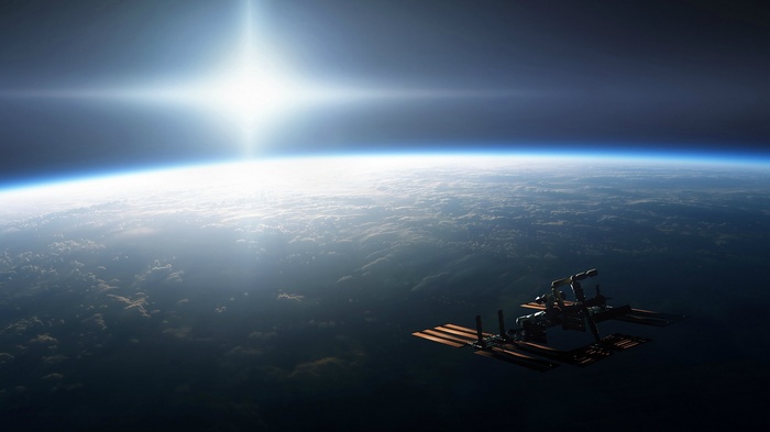 Space station orbiting Earth with bright sun