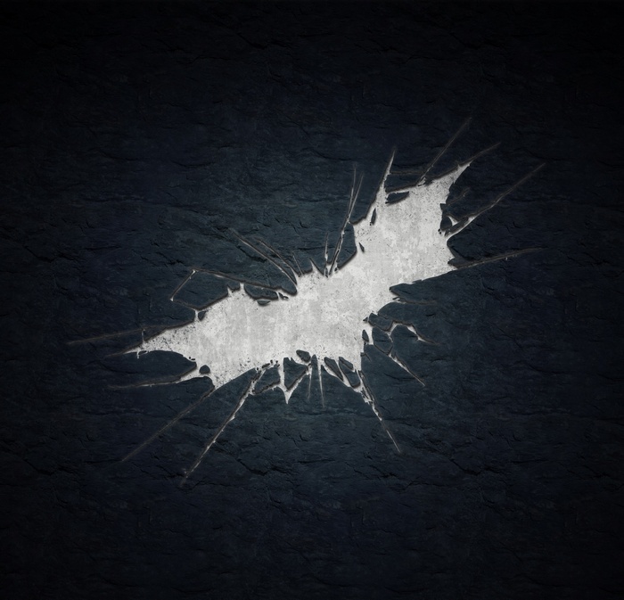 Batman logo on a dark textured surface