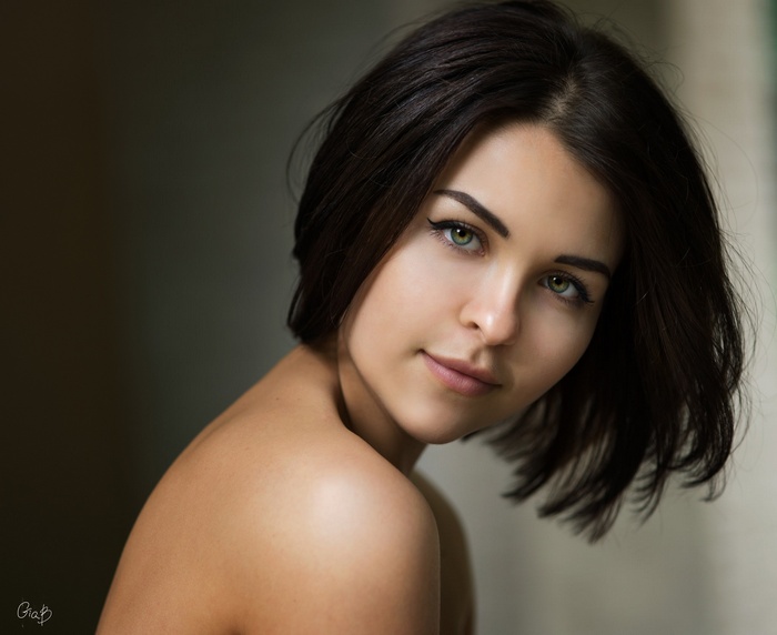 Portrait of a young woman with green eyes