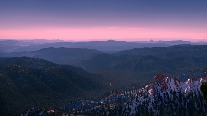 Bryce Canyon National Park mountains at sunset with snow