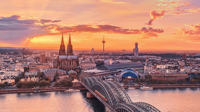 Cologne Cathedral and Hohenzollern Bridge at sunset