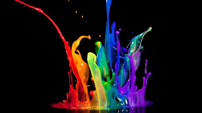 Rainbow paint splatter on black background