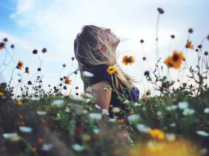 Woman in a field of flowers