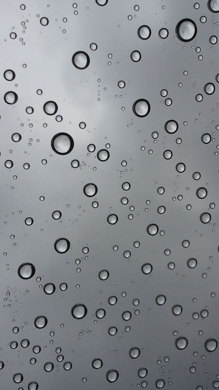 Water drops on a gray surface