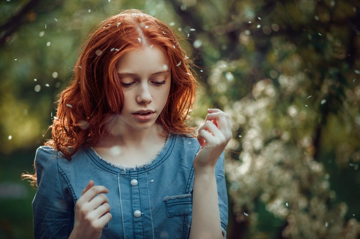 Ekaterina Yasnogorodskaya with red hair in a blue dress