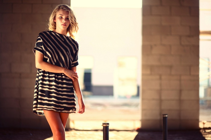 Model Garrett Meyers in a striped dress