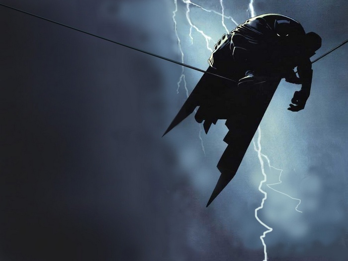 Batman sitting on a wire during a lightning storm