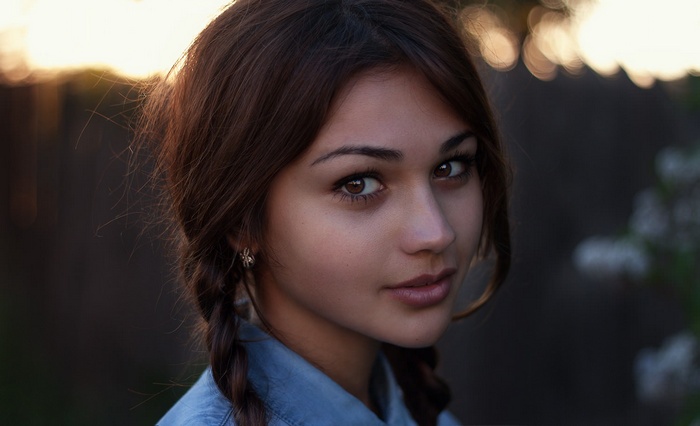Portrait of a young woman with braided hair