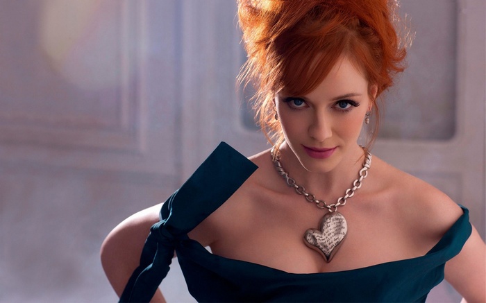 Christina Hendricks wearing a blue dress and necklace