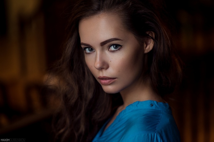 Portrait of a woman with blue eyes and brunette hair