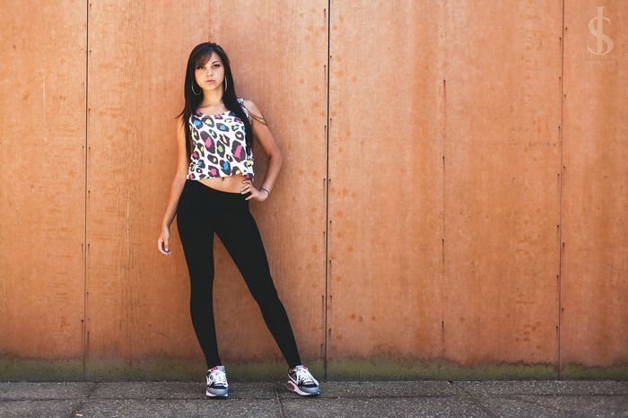 Woman in leopard print crop top and black leggings