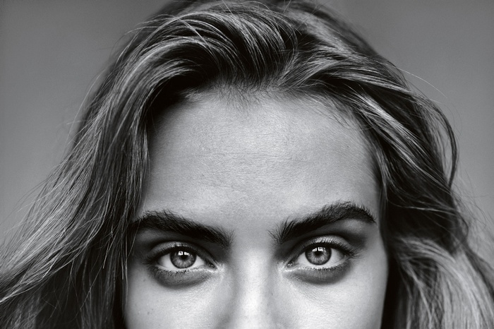 Monochrome close-up of Cara Delevingne's eyes and hair