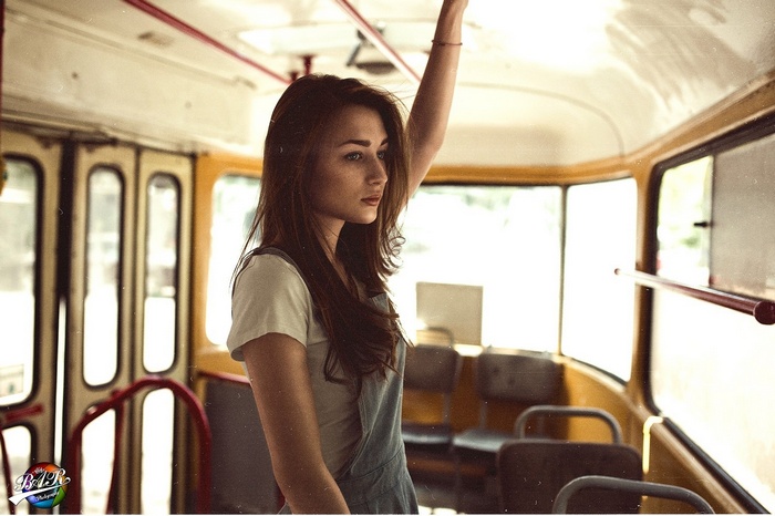 Woman with long hair on a bus