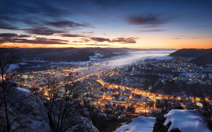 Winter cityscape at sunset with mist in Germany