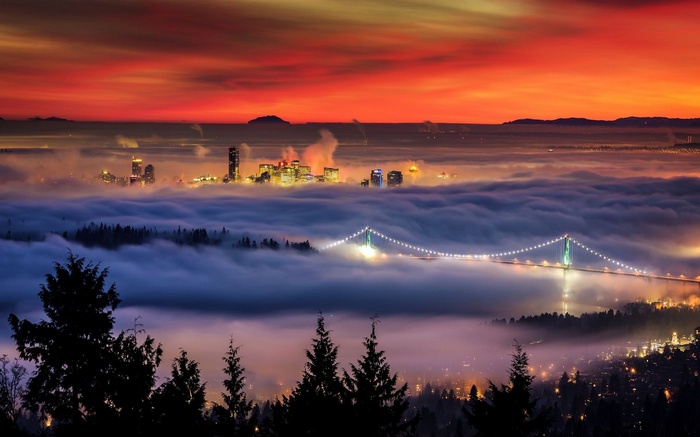 Vancouver cityscape shrouded in mist at sunset