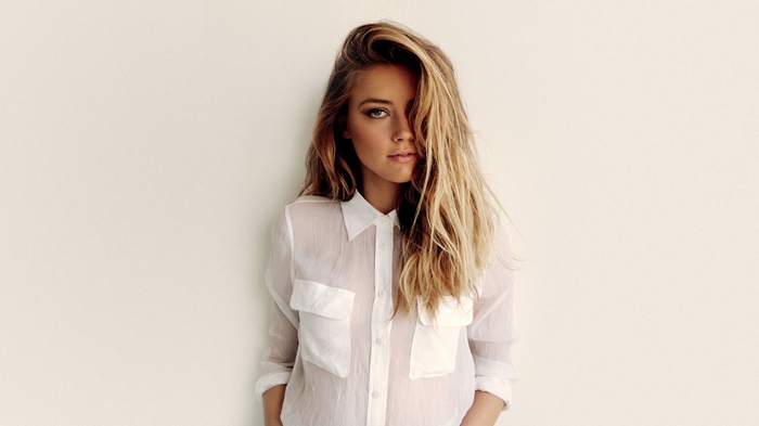 Amber Heard wearing a sheer white shirt