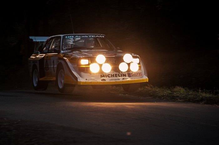Audi Sport Quattro S1 rally car with bright headlights