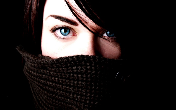 Woman with blue eyes wearing a scarf