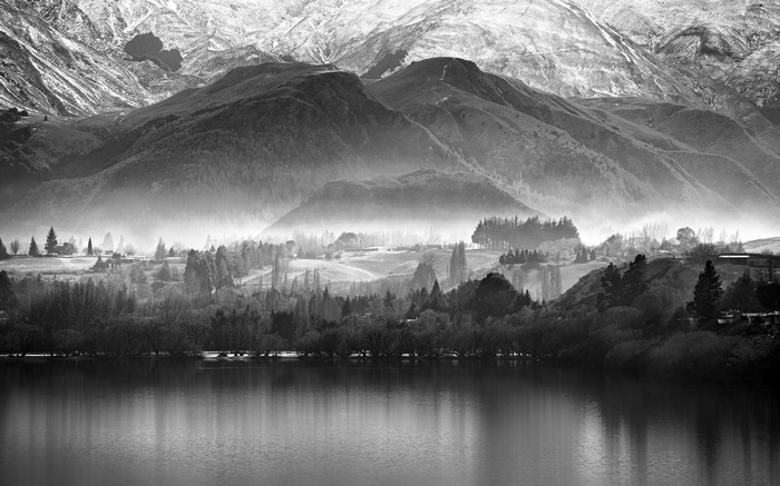 Misty Mountains Overlooking a Lake at Dawn