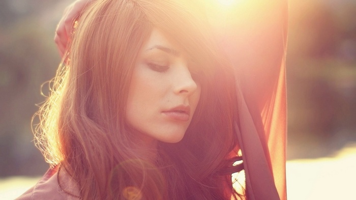 Woman with long hair in sunlight
