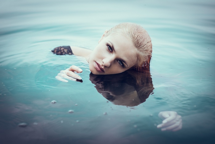 Woman with blonde hair in water