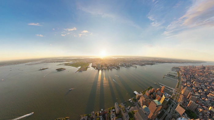 New York City cityscape at sunset over the river
