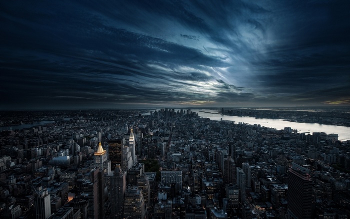 New York City skyline under dramatic clouds