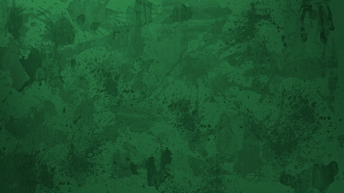 Abstract green watercolor splashes on a dark background