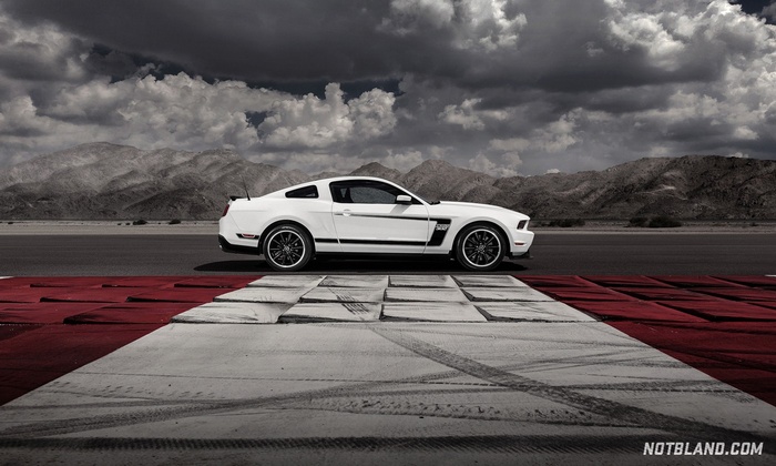 White Ford Mustang Boss 302 on a Racetrack