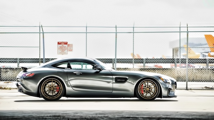 Mercedes Benz AMG GT parked near a fence