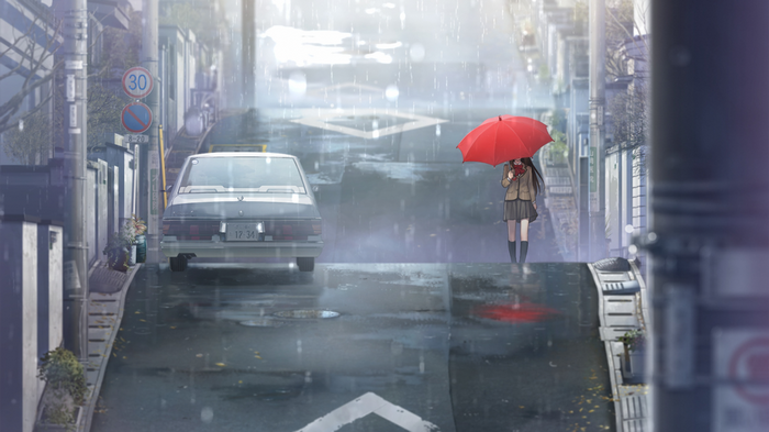 Schoolgirl with red umbrella in the rain